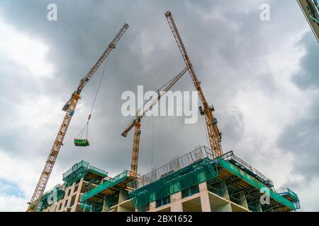 Cranes used to build a high rise builing in the Netherlands Stock Photo