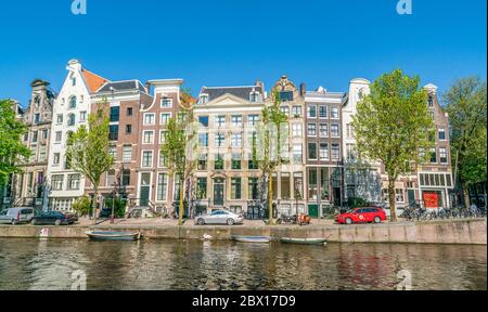 Amsterdam, May 7 2018 - The Keizersgracht with tourist wandering and traditional buildings on a sunny day Stock Photo