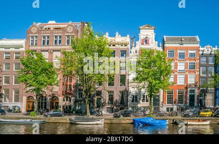 Amsterdam, May 7 2018 - The Keizersgracht with tourist wandering and traditional buildings on a sunny day Stock Photo