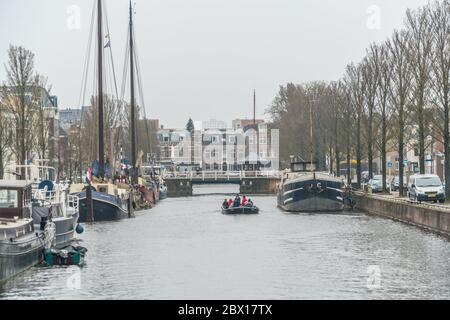 Leeuwarden, The Netherlands, april 14 2018, People sailing on the Ooster stadsgrachr in the old center Stock Photo