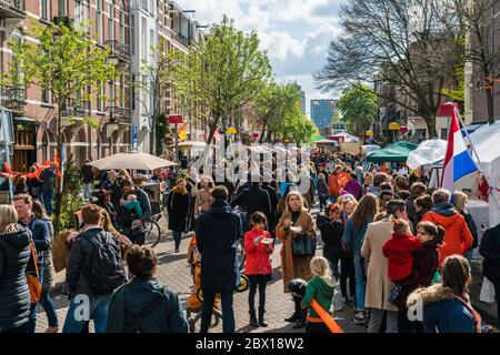 Amsterdam, The Netherlands, April 27 2017: Locals and tourists strawling on the free market of Kingsday in Amsterdam Stock Photo