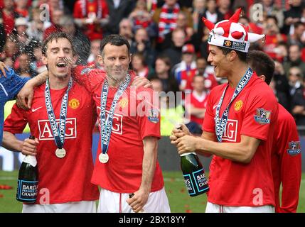 File photo dated 16-05-2009 of Manchester United's Cristiano Ronaldo (right), Ryan Giggs (centre) and Gary Neville (left) celebrate after winning the Barclays Premier League Stock Photo