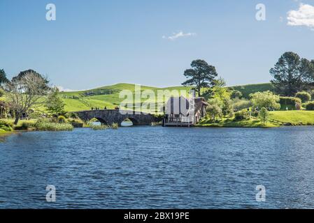 Watermill at a lake at Hobbiton in New Zealand Stock Photo