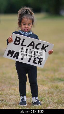 Sicaria, aged 2, during a Black Lives Matter protest rally at Eastville Park in Bristol in memory of George Floyd who was killed on May 25 while in police custody in the US city of Minneapolis. Stock Photo