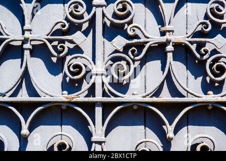 old stained wood with wrought iron design Stock Photo