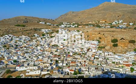 Birds eye view of Lindos Village whitewashed buildings in Rhodes viewed from the Lindos Acropolis Stock Photo