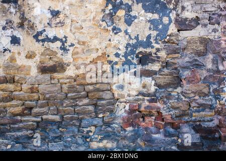 Detail shot of an old brick wall and crumbling cement Stock Photo