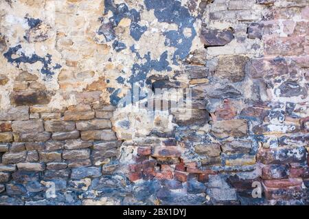 Detail shot of an old brick wall and crumbling cement Stock Photo