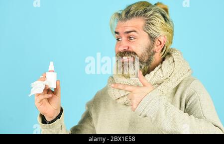 no addiction to medicals. coronavirus from china. happy hipster presenting best remedy. Nasal drops plastic bottle. pandemic concept. man treat runny nose with nasal spray. free your stuffy nose. Stock Photo