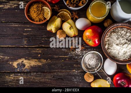 Autumn baking concept. Cooking baking background with ingredients, spices and utensils. All you need for baking traditional autumn apple pie, on rusti Stock Photo