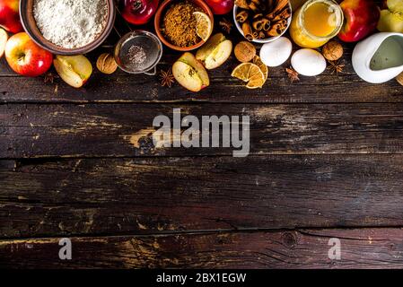 Autumn baking concept. Cooking baking background with ingredients, spices and utensils. All you need for baking traditional autumn apple pie, on rusti Stock Photo