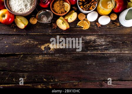 Autumn baking concept. Cooking baking background with ingredients, spices and utensils. All you need for baking traditional autumn apple pie, on rusti Stock Photo