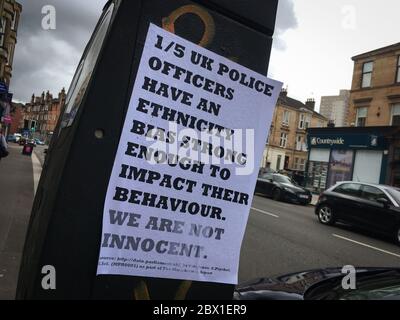 Glasgow, UK, 4th June 2020. A sign talking of the UK police force and ethnic biases has appeared in the Southside of the city, in the days when police attitudes and racism are being closely watched in the media following recent rioting in USA sparked by police brutality and racism, and the death of George Floyd. In Glasgow, Scotland, on 4 June 2020. Photo credit: Jeremy Sutton-Hibbert/Alamy Live News. Stock Photo