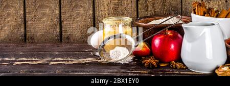 Autumn baking concept. Cooking baking background with ingredients, spices and utensils. All you need for baking traditional autumn apple pie, on rusti Stock Photo