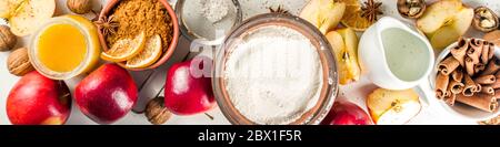 Autumn baking concept. Cooking baking background with ingredients, spices and utensils. All you need for baking traditional autumn apple pie, on rusti Stock Photo