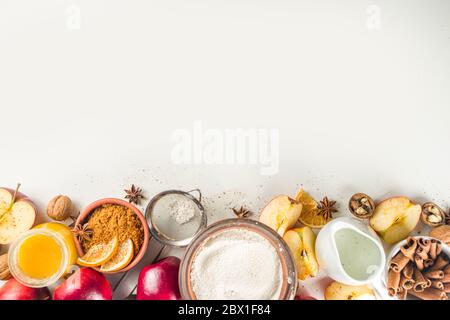 Autumn baking concept. Cooking baking background with ingredients, spices and utensils. All you need for baking traditional autumn apple pie, on rusti Stock Photo