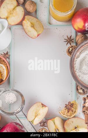 Autumn baking concept. Cooking baking background with ingredients, spices and utensils. All you need for baking traditional autumn apple pie, on rusti Stock Photo