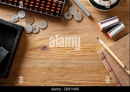 asia traditional desktop background with writing brush inkstone and other vintage objects Stock Photo