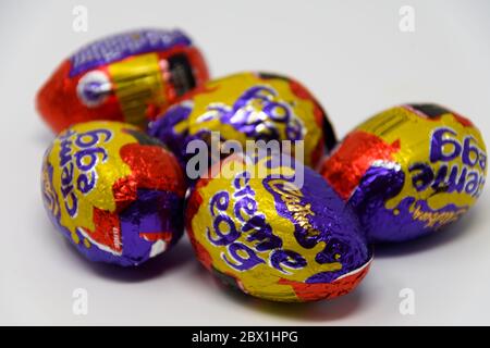 Reading, United Kingdom - April 19 2019:  Five Cadbury's Creme Eggs in their foil wrappers Stock Photo