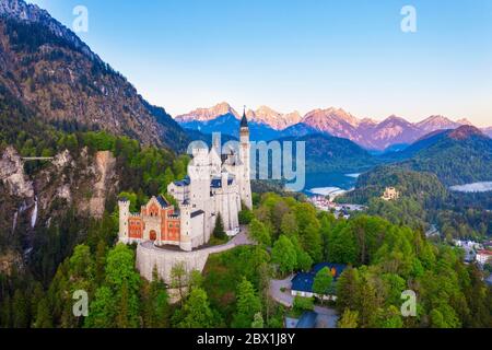 Neuschwanstein Castle, Marienbruecke, Tannheimer Berge in the morning light, Hohenschwangau Castle, Alpsee, near Schwangau, drone shot, East Allgaeu Stock Photo