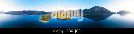 360 degree panorama of Walchensee with peninsula dwarfs in the morning light, drone shot, Upper Bavaria, Bavaria, Germany Stock Photo