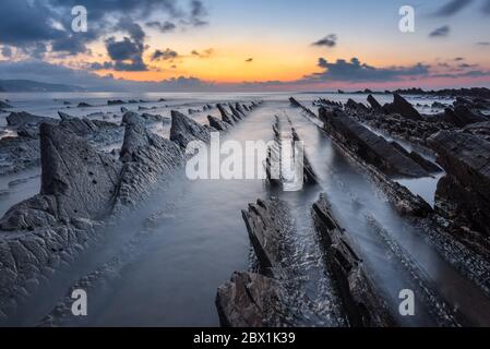 Flysch of Sakoneta beach at sunset, Basque Coast Geopark, Spain Stock Photo