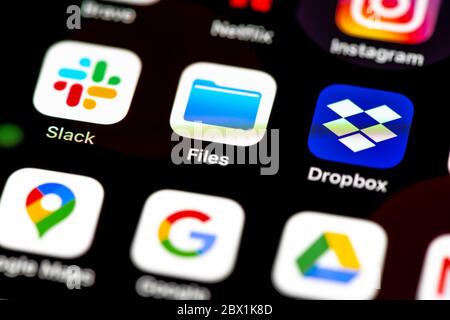 Slack, Apple Files, Dropbox, App Icons on a mobile display, iPhone, Smartphone, close-up Stock Photo