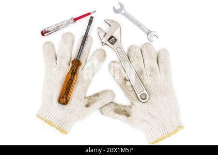 old tools include Gloves, wrench and screwdriver Stock Photo