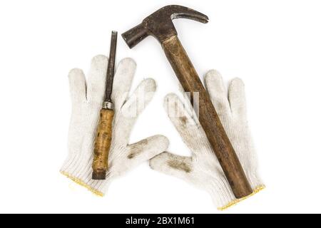 Old Tools include gloves, hammer and chisel. Stock Photo