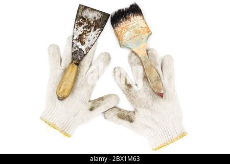 Old tools include Gloves, paint brushes and trowel Stock Photo