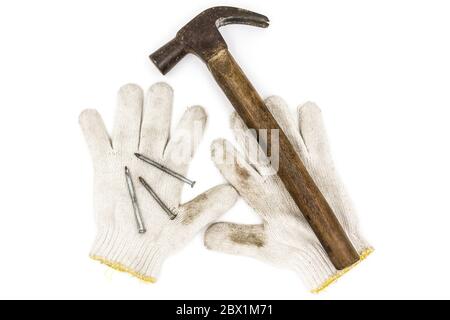 Old tools include Gloves, hammer and nails Stock Photo