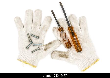 Old tools include Gloves, screwdrivers and nut Stock Photo