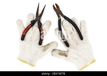 Old tools include gloves and pliers Stock Photo
