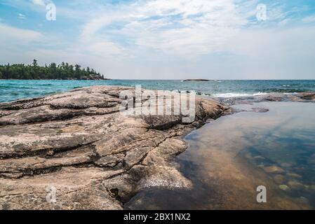 Rocky promontory in Superior Lake Park. Canada Stock Photo