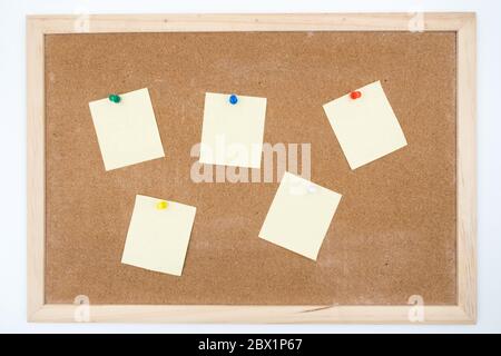 Blank papers pin up on cork board. Stock Photo
