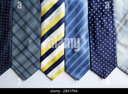 Many different colorful ties, on white background Stock Photo