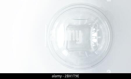 Empty Transparent plastic Container on White Background Stock Photo