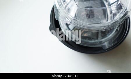 Black and white Plastic food containers on white background Stock Photo