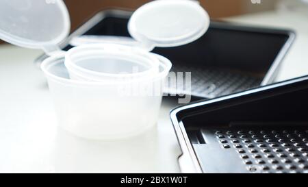 Empty plastic containers for sushi set delivery. Take away lunch box Stock Photo
