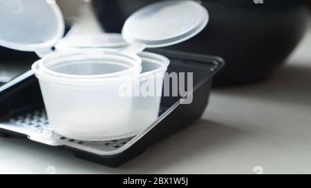 Empty plastic containers for sushi set delivery. Take away lunch box Stock Photo