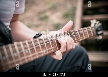 Technique of playing the electric guitar - bending up - heavy hard rock and blues music Stock Photo