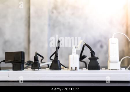 Multiple socket with connected plugs. Stock Photo