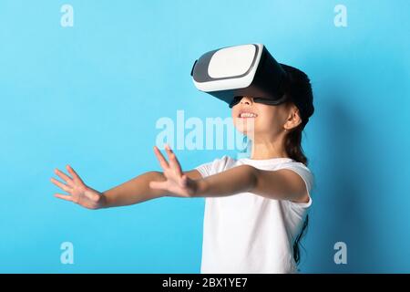 Girl wearing virtual reality goggles at the studio Stock Photo