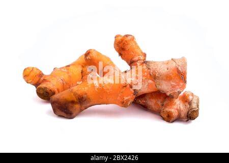 Turmeric roots on white background. Stock Photo
