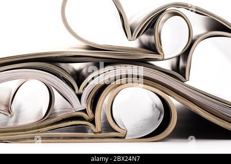 selective focus of the stacking magazine place on white background. Colorful abstract background Stock Photo