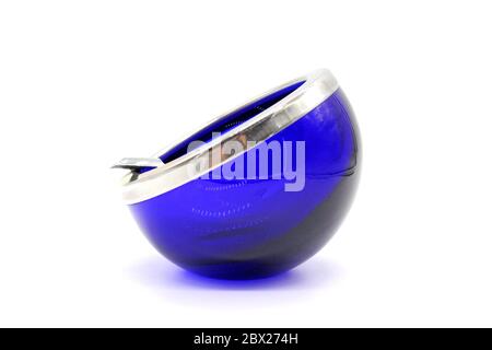 Blue vintage glass and metal ashtray, isolated on a white background Stock Photo