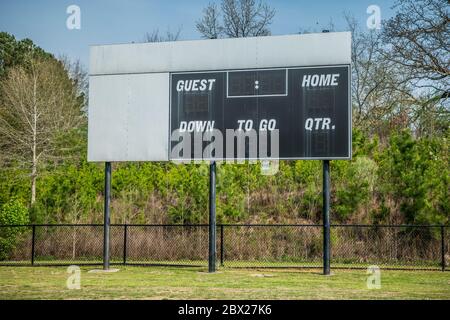 A blank and unused scoreboard at a soccer field in a park turned off due to the park being closed because of Covid-19 pandemic closeup Stock Photo