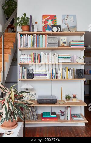 Bookshelves in eclectic loft home office Stock Photo