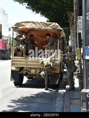 Hollywood, CA/USA - June 3, 2020: National Guard troops load into a truck in Hollywood  during the Black Lives Matter protests Stock Photo