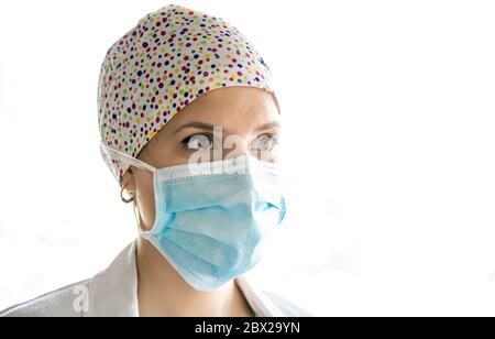 Young medical professional with procedure mask on her face Stock Photo